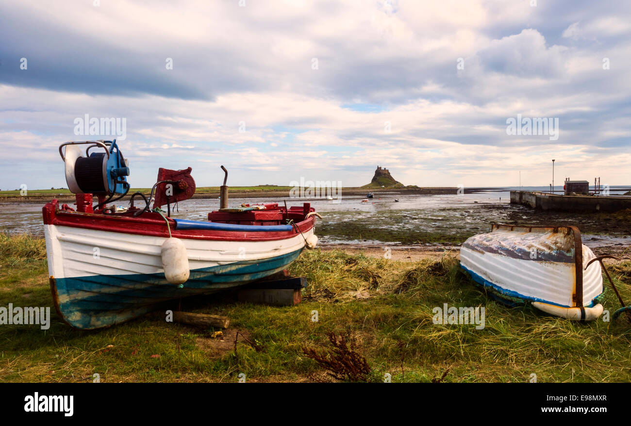 Holy Island, Northumberland. Boats and harbour with Lindisfarne Castle. Stock Photo