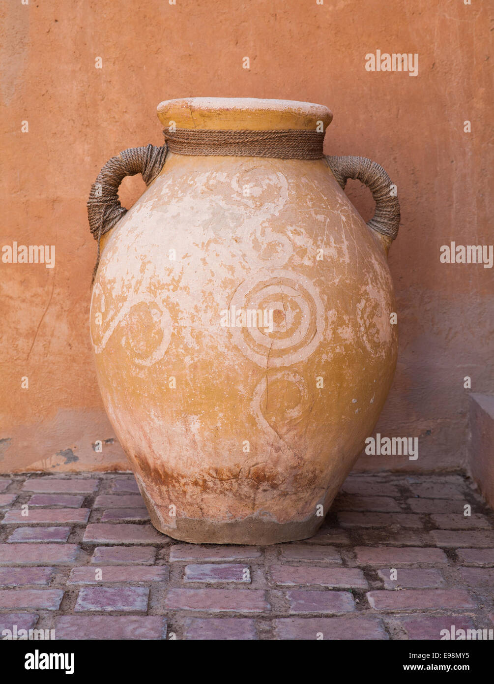 Big old clay jug with double handles (Arabic style) decorated with patterns Stock Photo Alamy