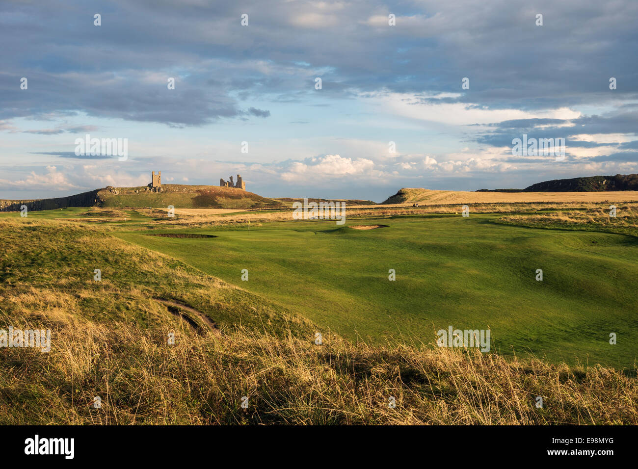 Embleton Golf Course with Dunstanbrough Castle in the background. Evening. Stock Photo