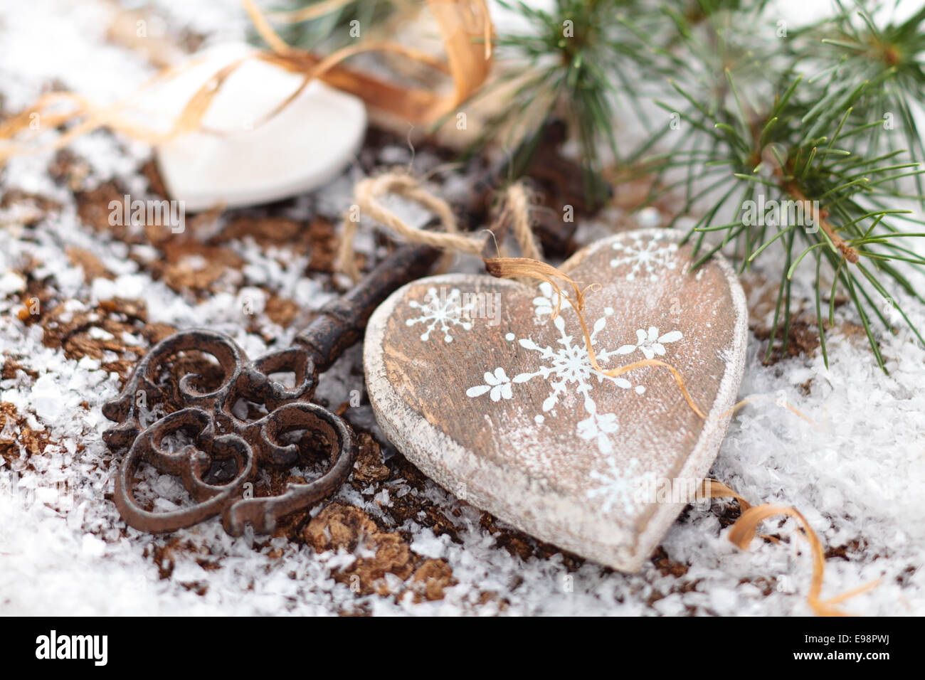 Wooden heart and key on winter background Stock Photo - Alamy