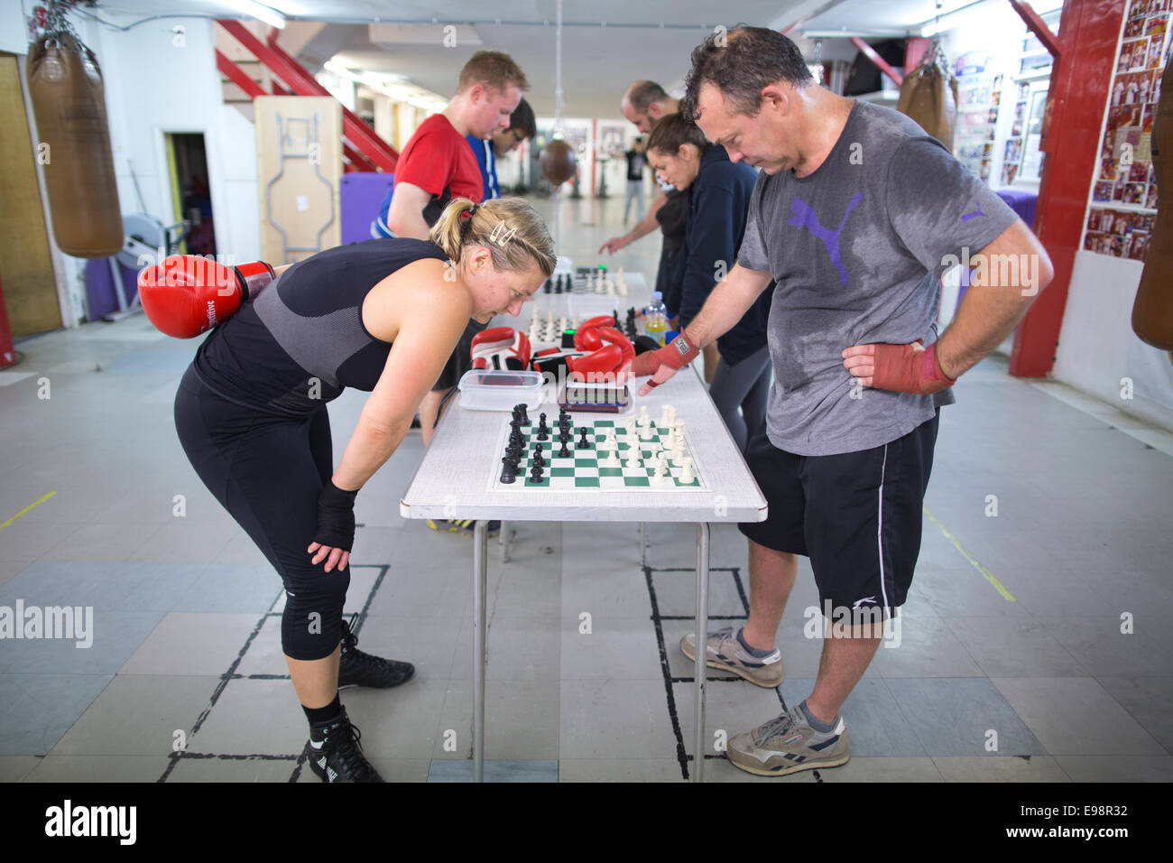 Chessboxing, boxing and chess board game being played alternately