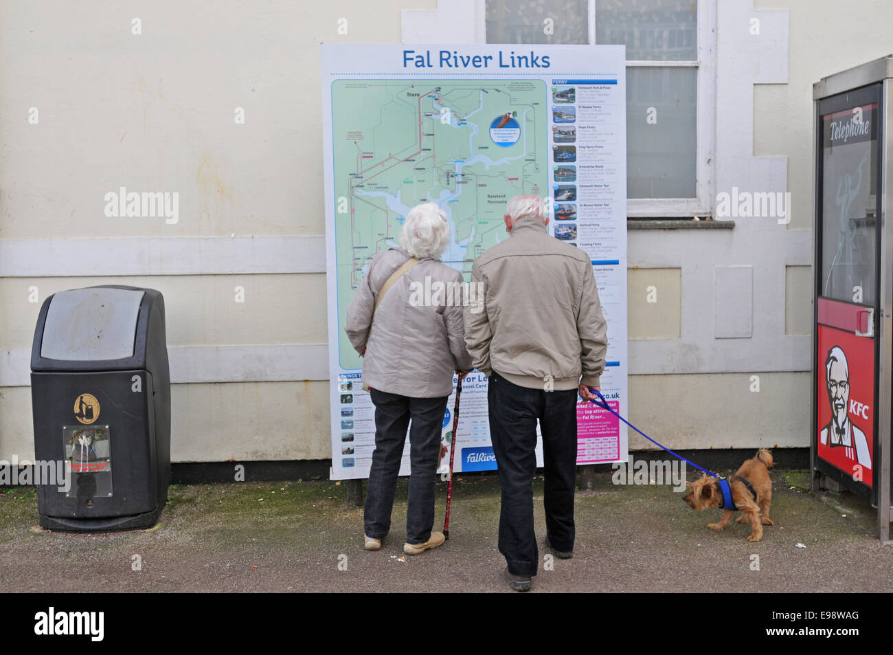 Senior couple looking at map, Falmouth, England, UK Stock Photo