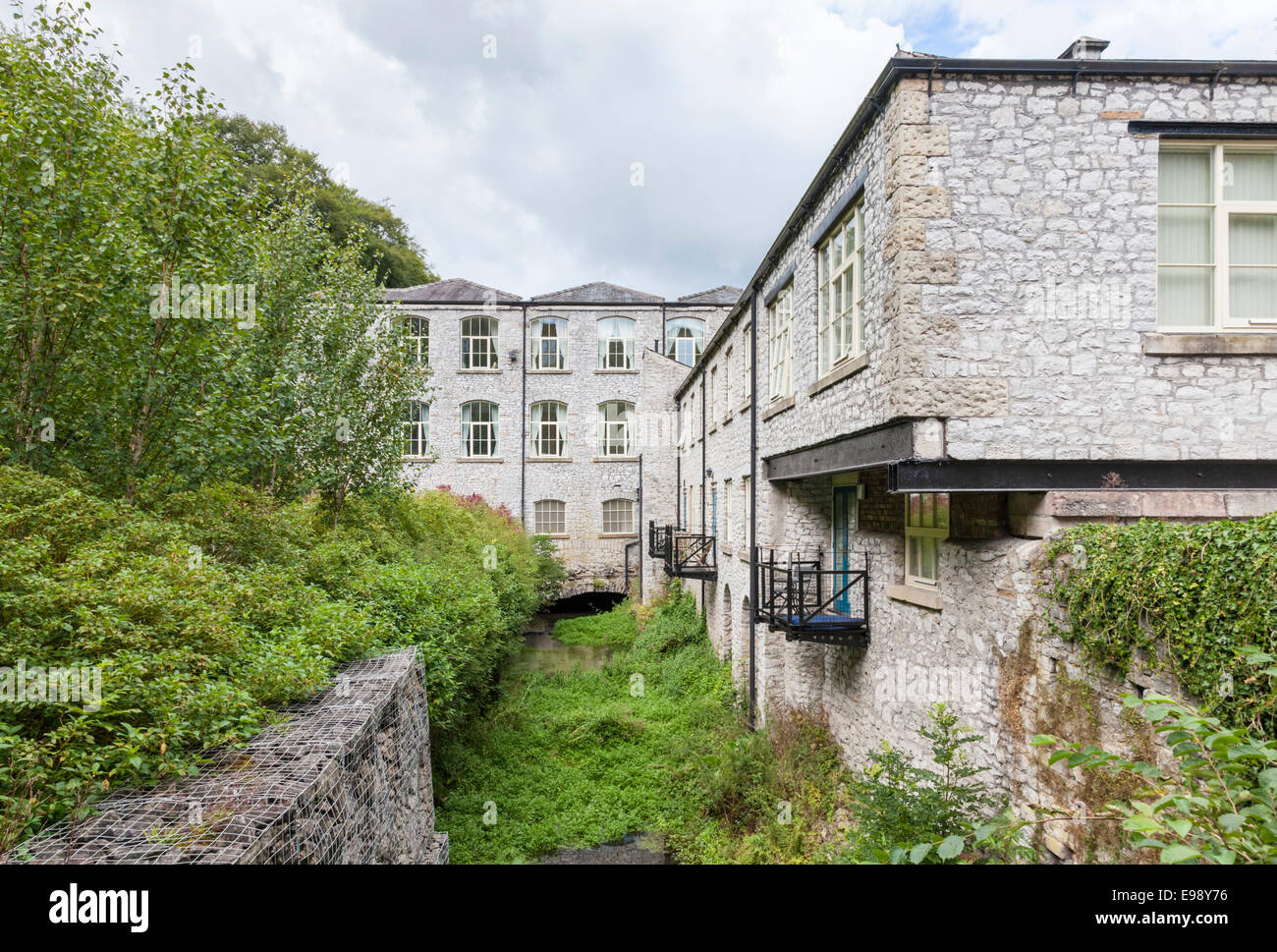 Building conversion. Litton Mill, now converted to a block of apartments, Derbyshire, England, UK Stock Photo