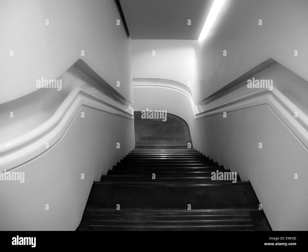 Black and white abstract view down stairwell Stock Photo
