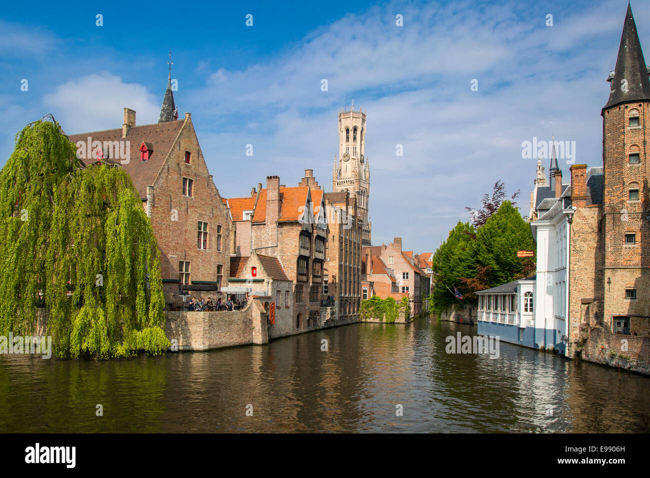 Belfry of Bruges towers over the buildings at the junction of the Groenerei and Dijver canals, Bruges, Belgium Stock Photo