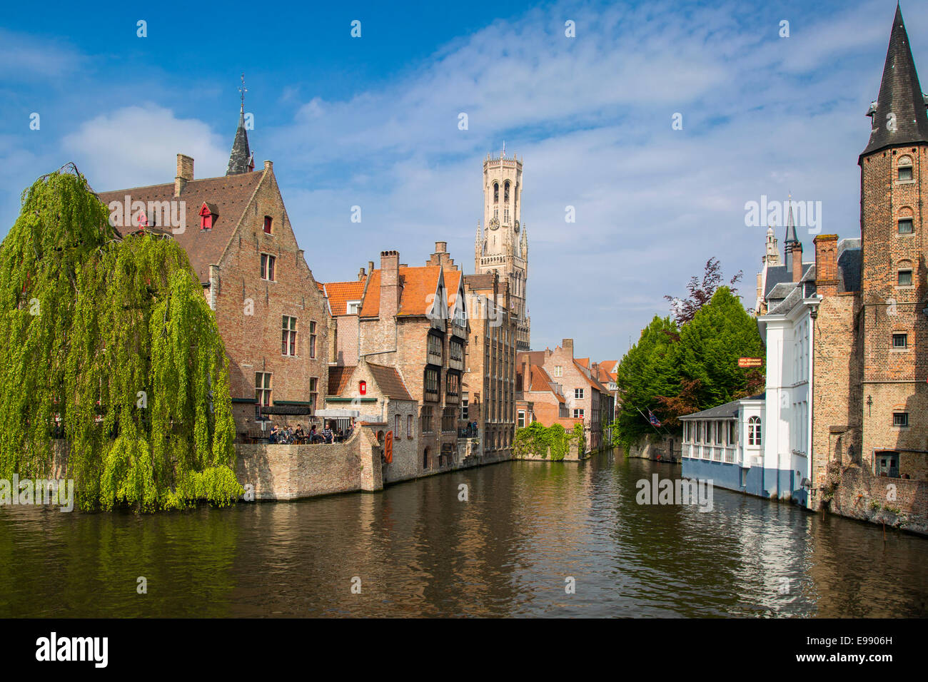 Belfry of Bruges towers over the buildings at the junction of the Groenerei and Dijver canals, Bruges, Belgium Stock Photo