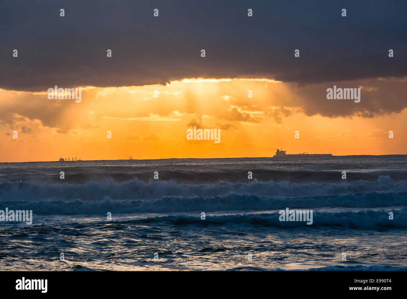 Ships dawn sunrise silhouetted on ocean sea horizon landscape Stock ...