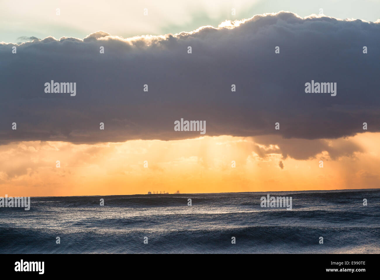 Ships dawn sunrise silhouetted on ocean sea horizon landscape Stock ...