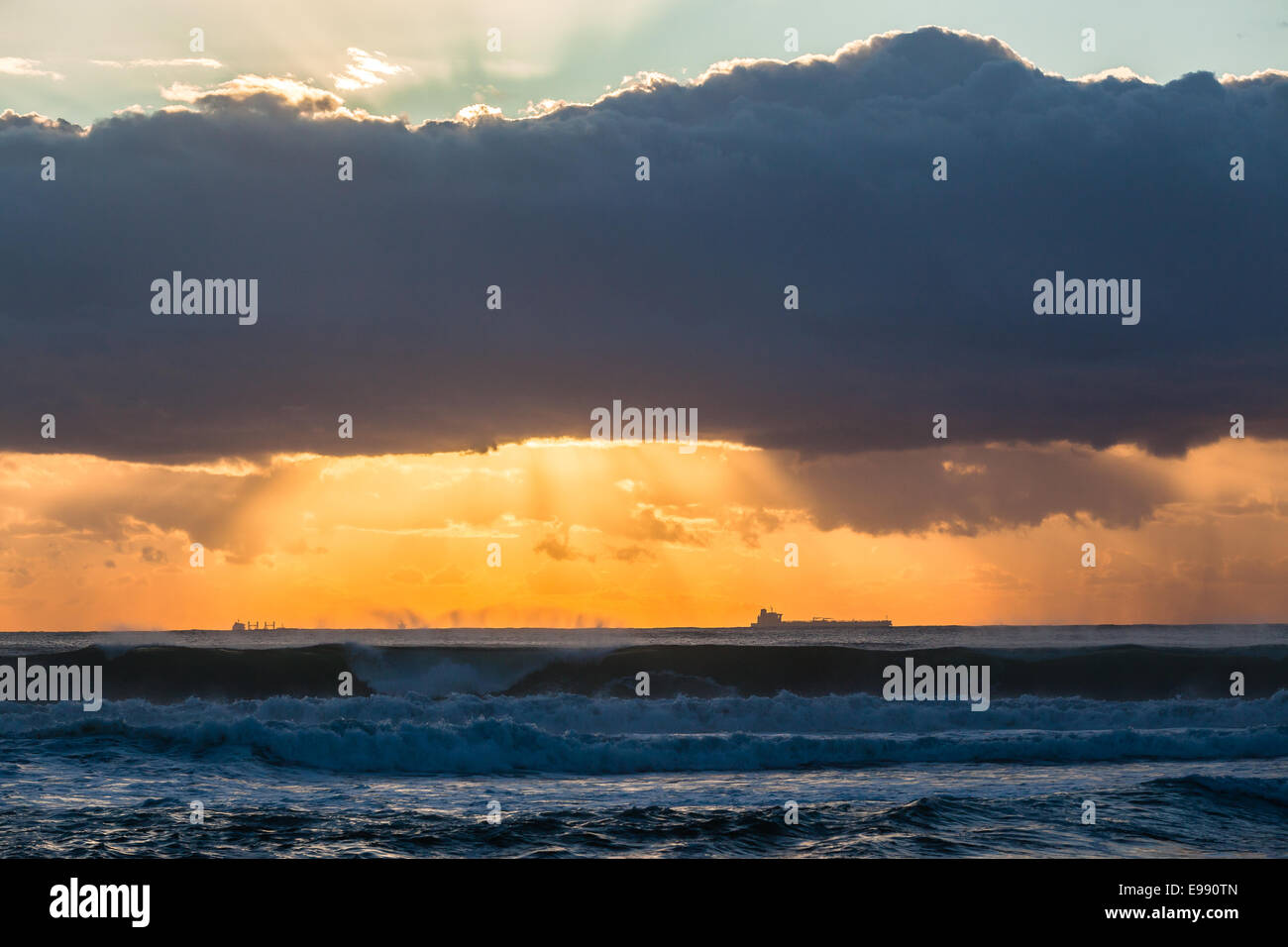 Ships dawn sunrise silhouetted on ocean sea horizon landscape Stock ...