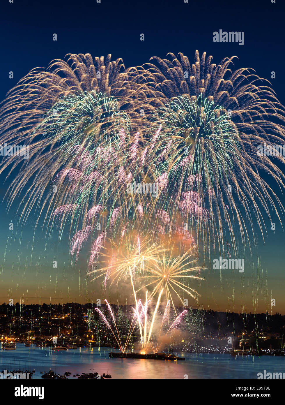 Holiday Fireworks over the water Stock Photo Alamy