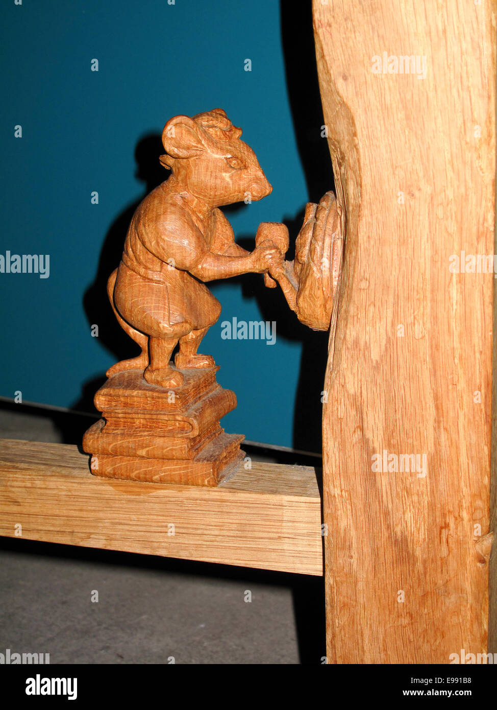 Small Carved Wooden Mouse As Trademark On Wooden Furniture Stock