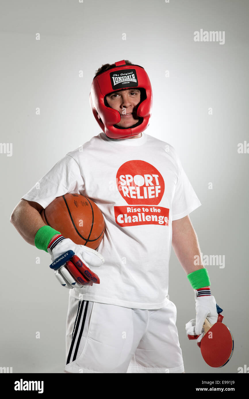man dressed up for sport relief in lots of different sports equipment Stock Photo Alamy