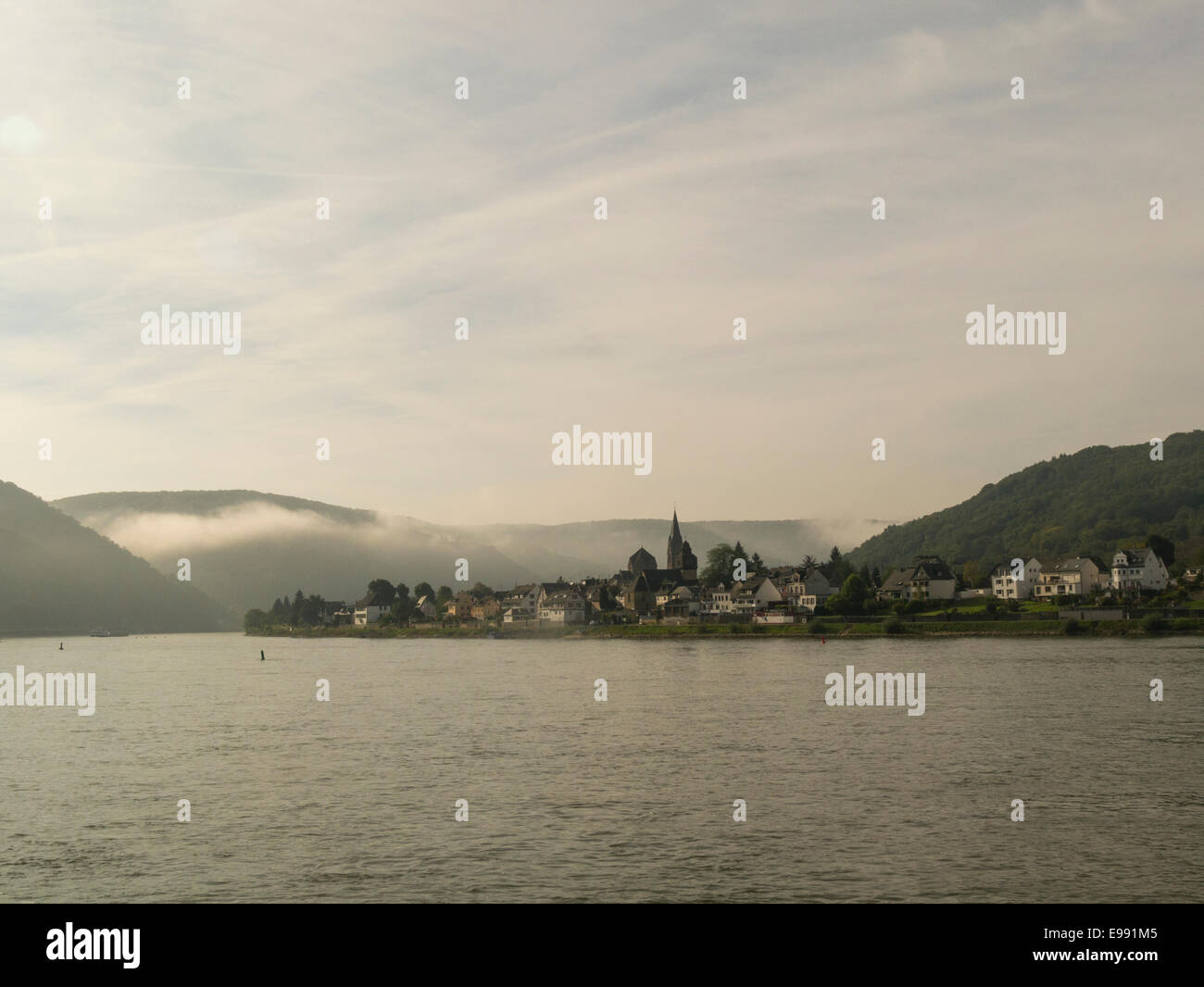 Looking across the River Rhine to Brey on left bank on misty autumn September morning Germany EU Stock Photo