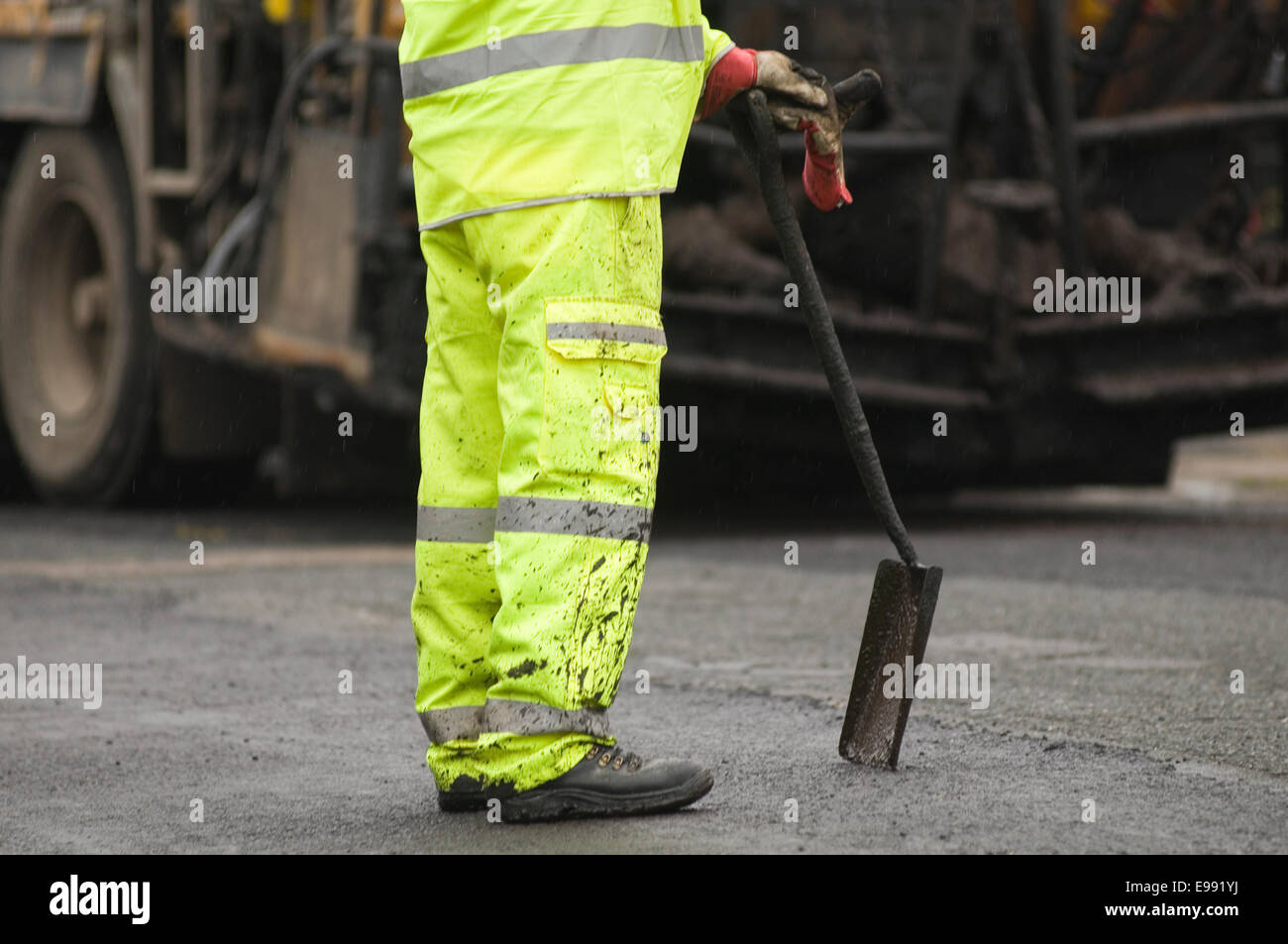 workman leaning on a shovel shovels roadworks productivity lazy man