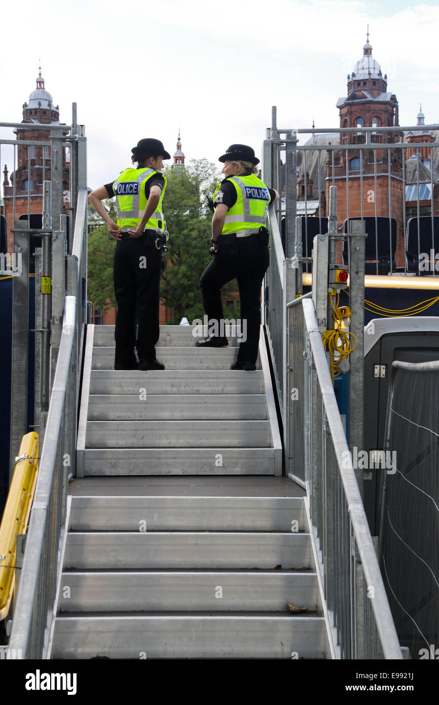 Female police officers on steps Stock Photo