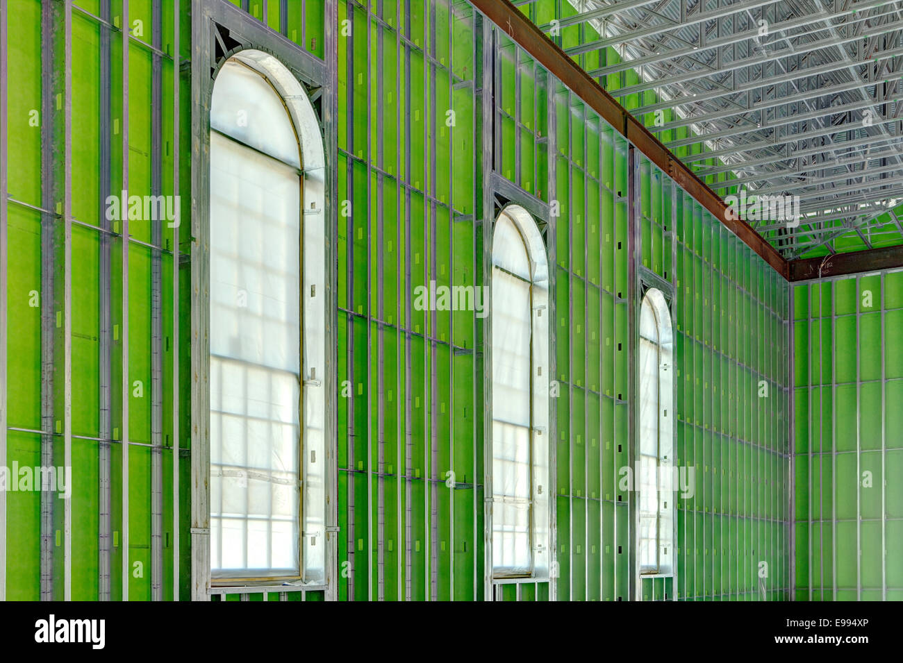 The interior of an office building under construction using steel studs, and green board Stock Photo