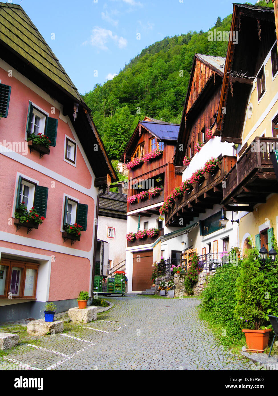 Street lined with traditional wooden houses in Hallstatt, Austria Stock