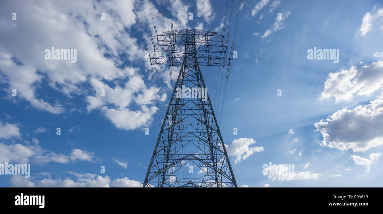 Centered Electric tower over blue sky and clouds Stock Photo - Alamy