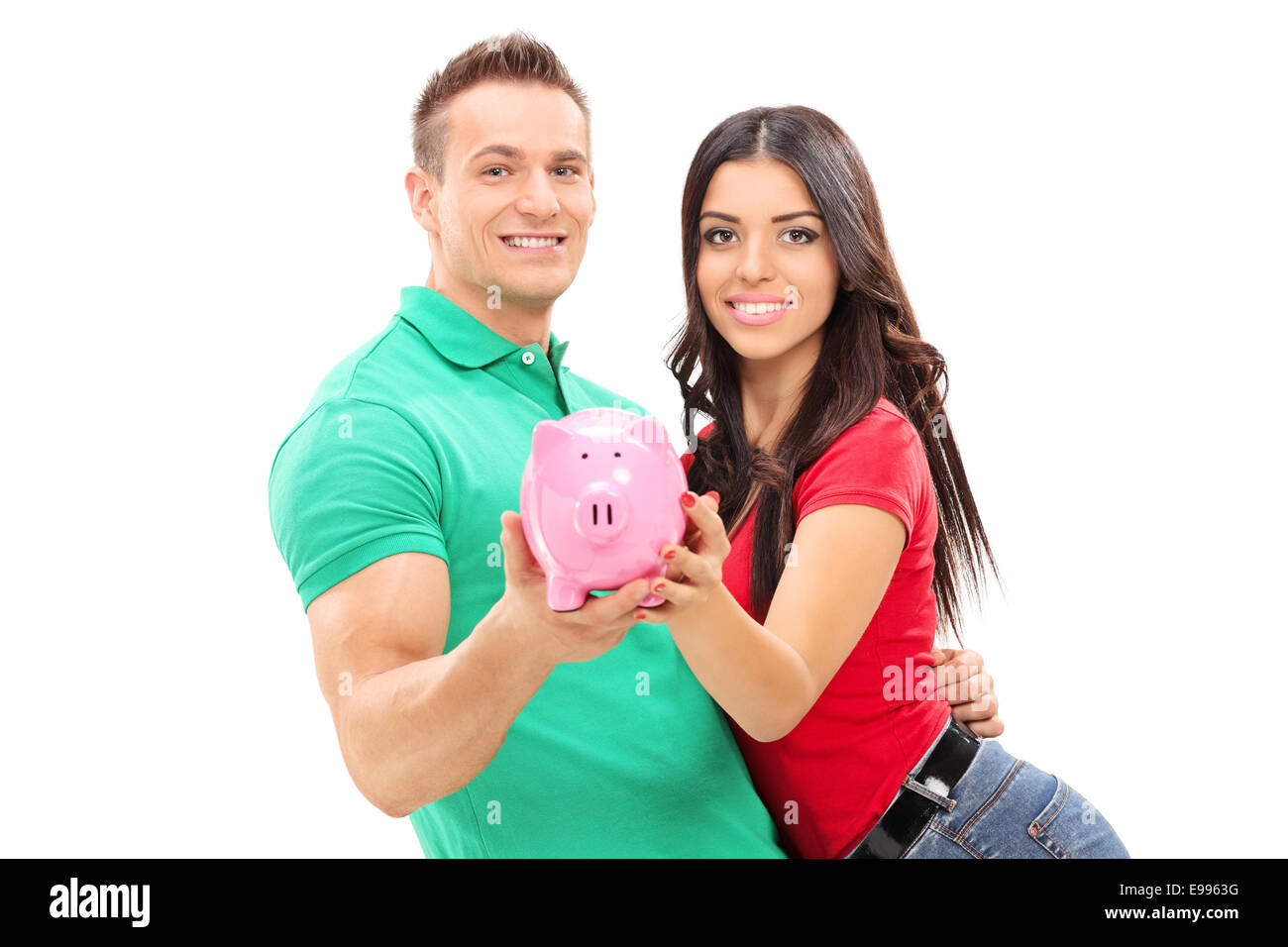 Young couple holding a piggybank isolated on white background Stock ...