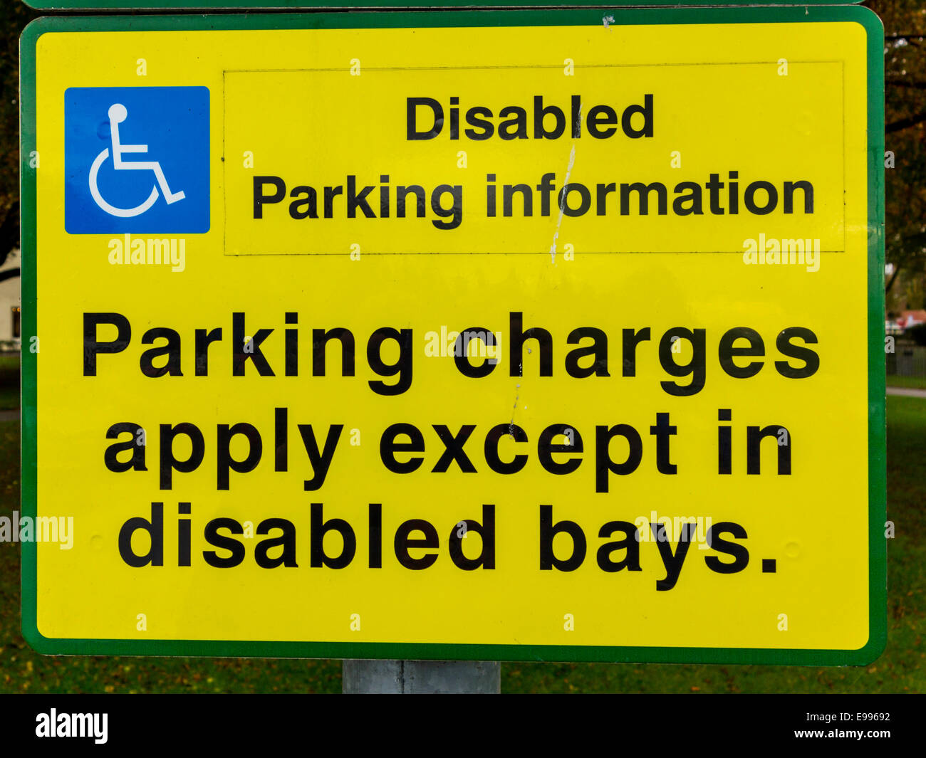 Sign reading Disabled Parking Information Parking Charges Apply except