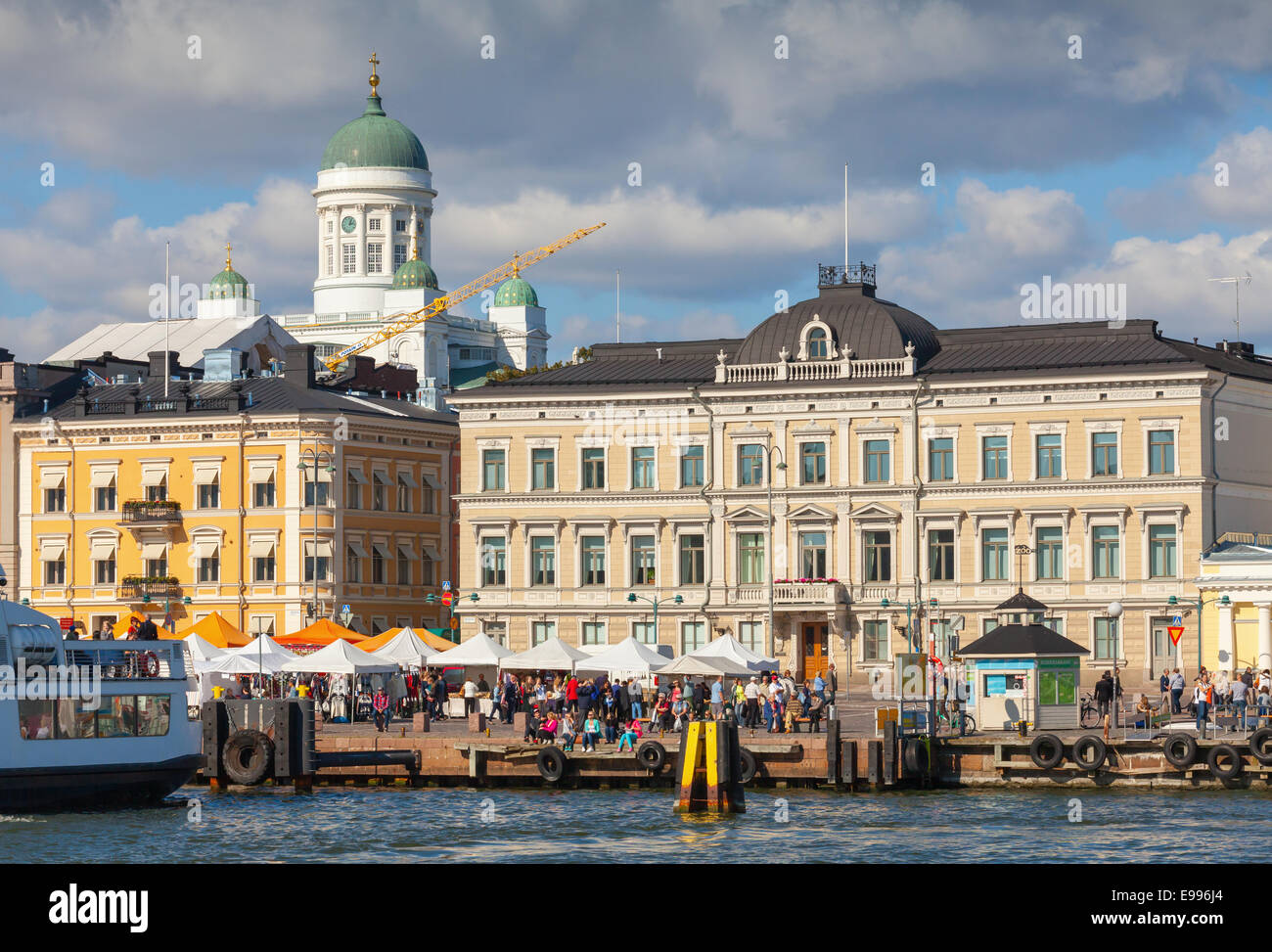 HELSINKI, FINLAND - SEPTEMBER 13, 2014: central quay of Helsinki with ships, walking people and dome of the main city cathedral Stock Photo