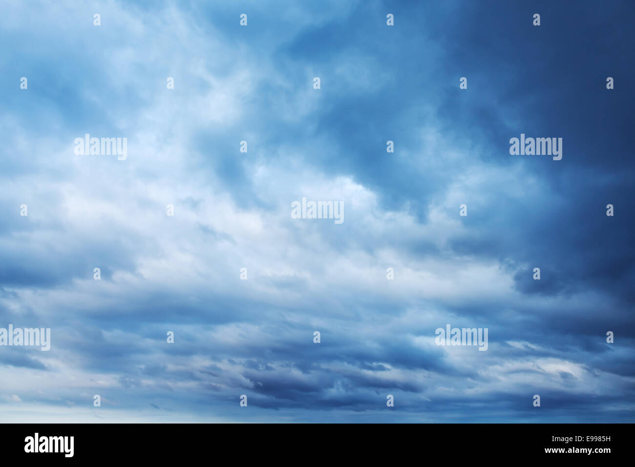 Dark blue stormy sky with clouds, abstract nature background Stock Photo