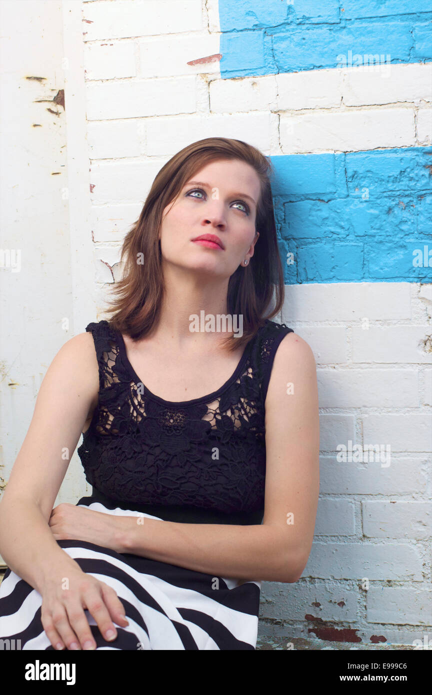 damsel in distress at warehouse downtown Stock Photo