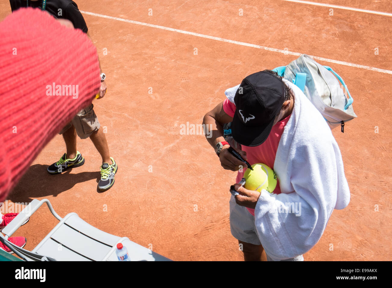 Spaniard Rafa Nadal signs signature,autograph for fans after end of his practice session practice court at Roland Garros,Paris. Stock Photo