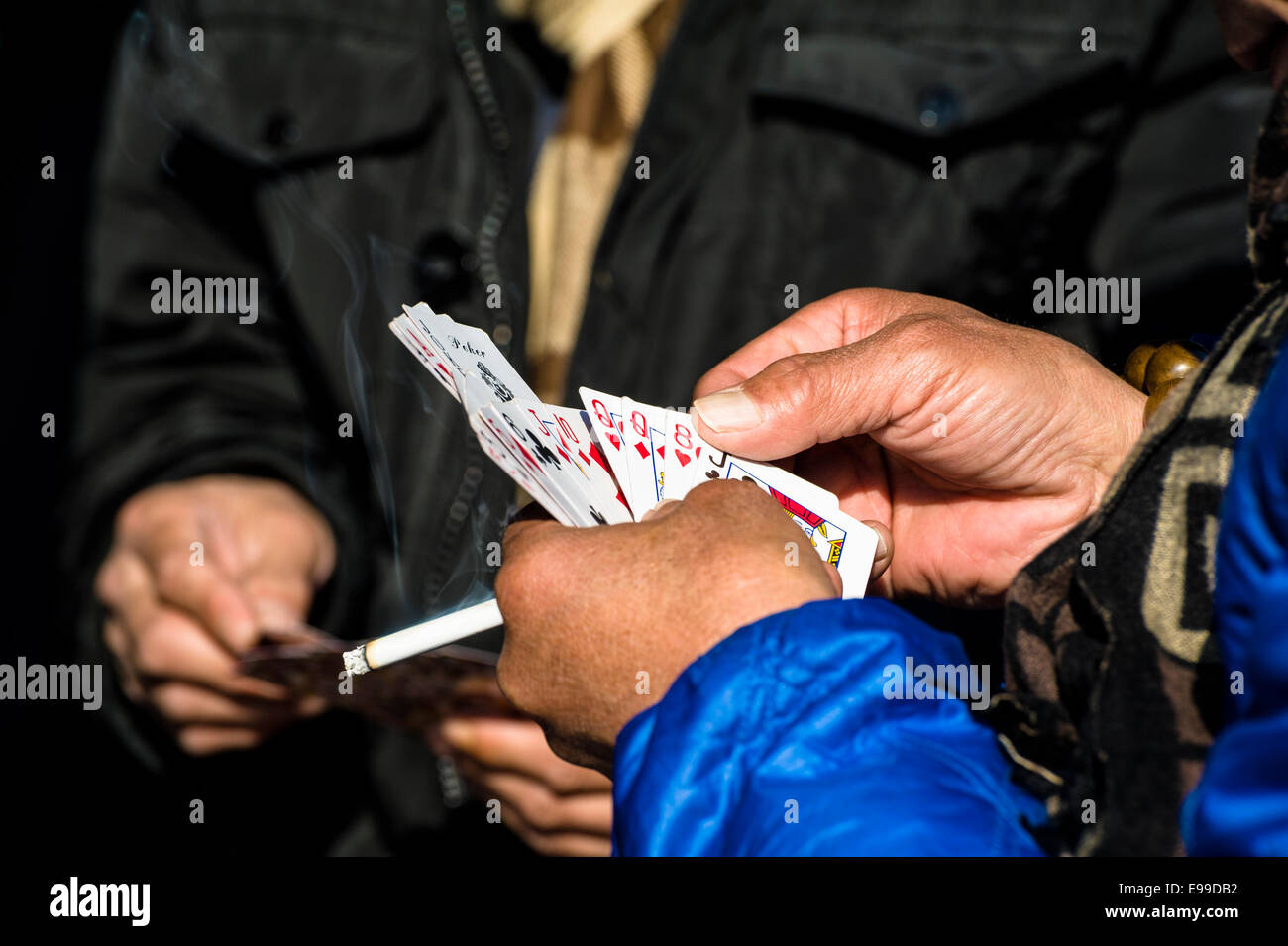 The man with a cigarette play card Stock Photo