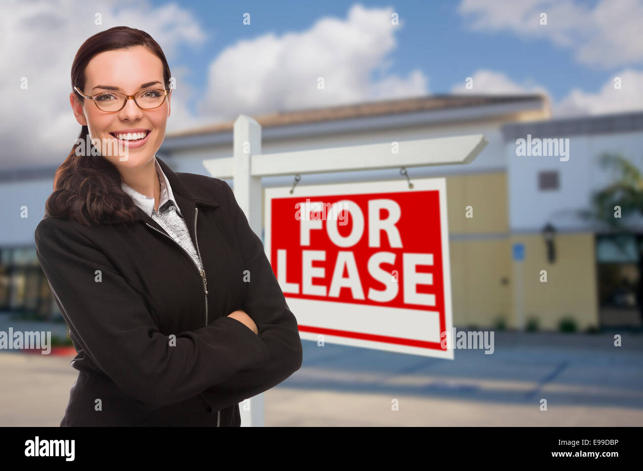Attractive Serious Mixed Race Woman In Front of Vacant Retail Building ...
