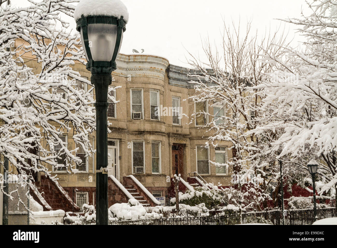 February 2014 snowstorm on the stoops of historic Brownstone apartments on Eastern Parkway in Crown Heights, Brooklyn Stock Photo