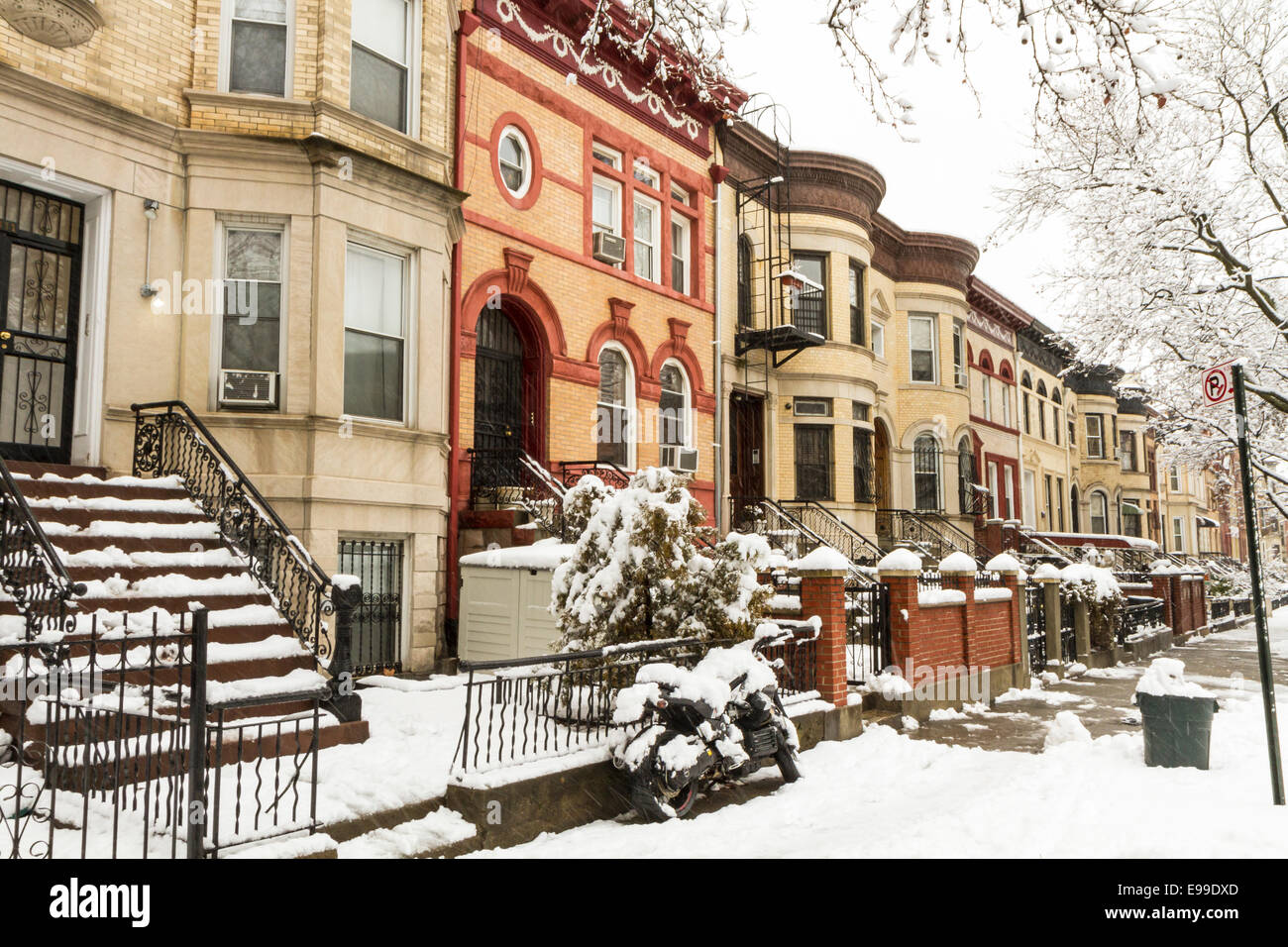 Snow on the stoops of historic Brownstone apartments on New York Avenue in Crown Heights, Brooklyn Stock Photo