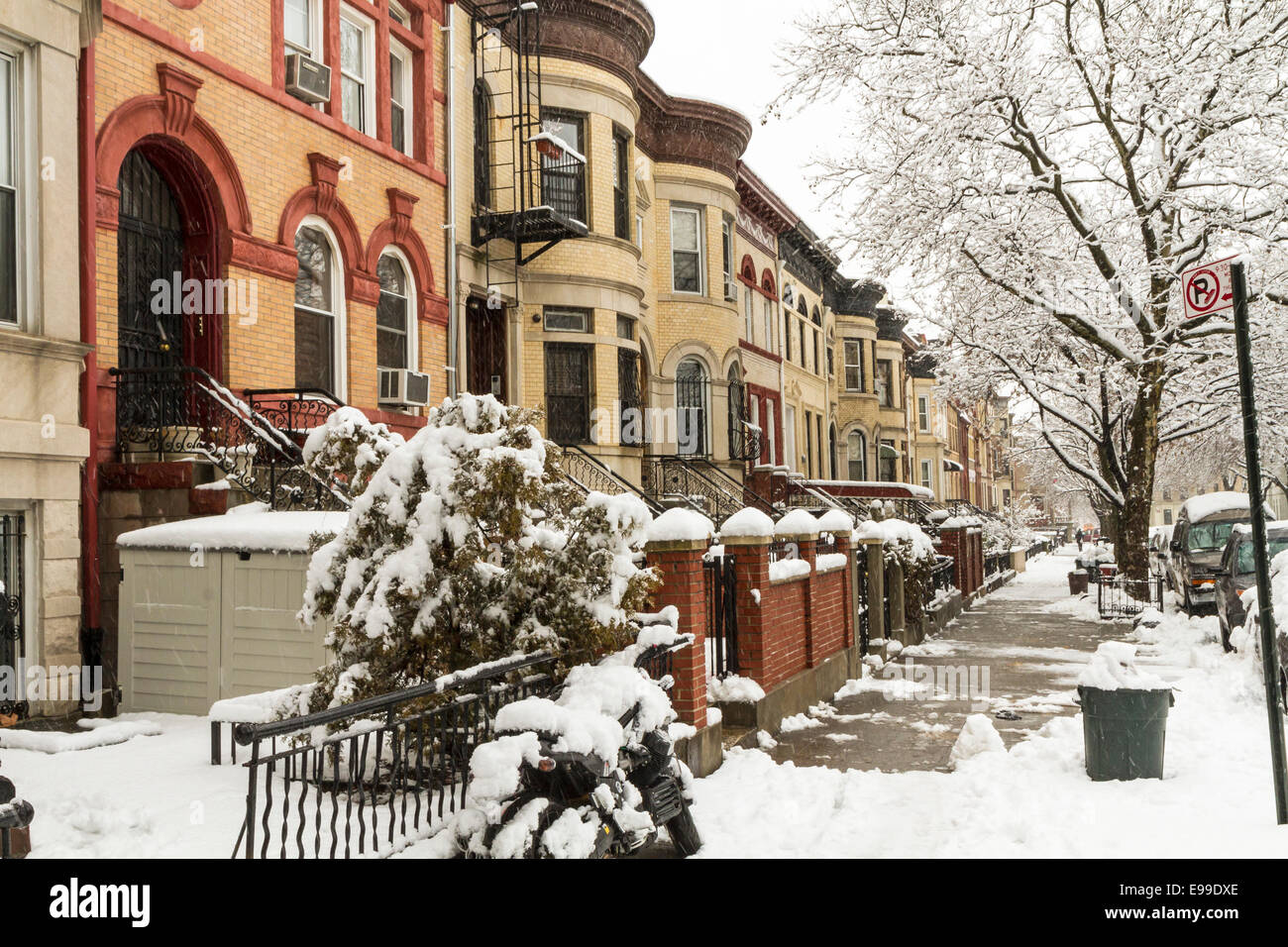 Snow on the stoops of historic Brownstone apartments on New York Avenue in Crown Heights, Brooklyn Stock Photo