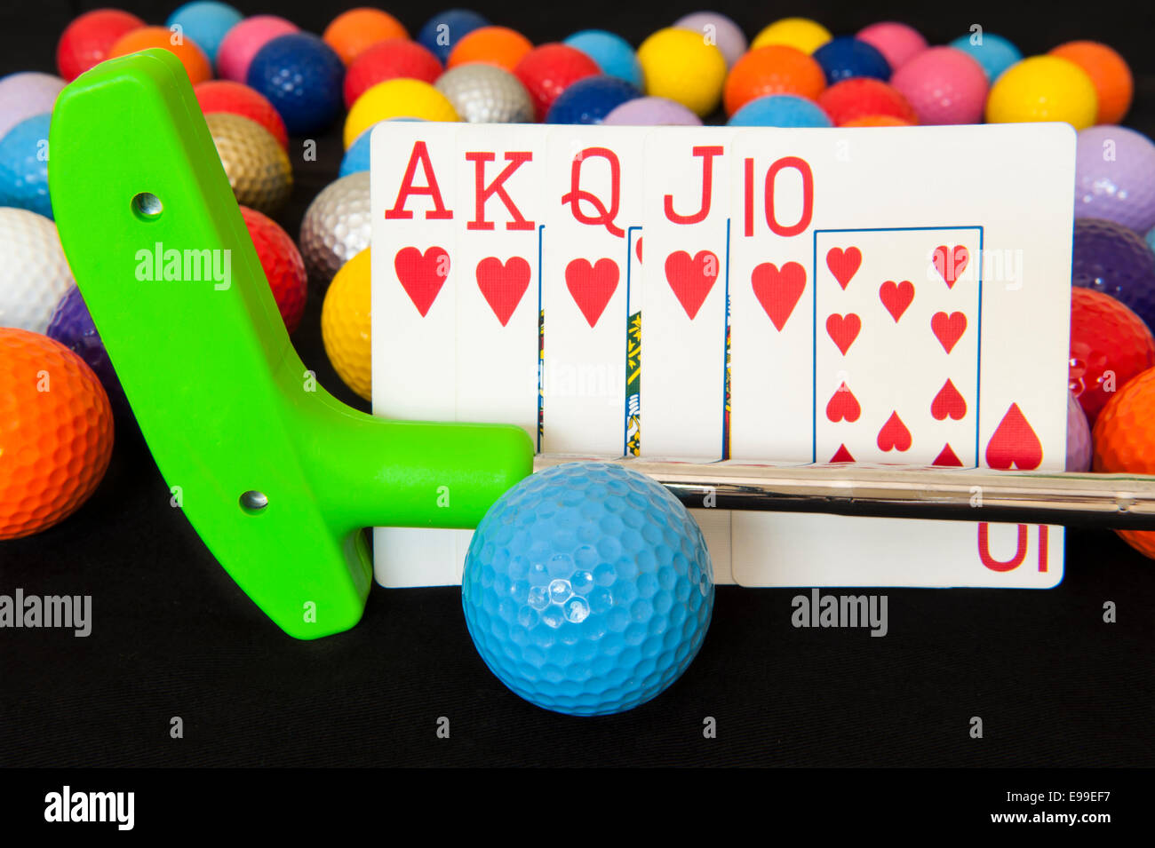 Royal flush poker hand with mini golf putter and balls Stock Photo Alamy