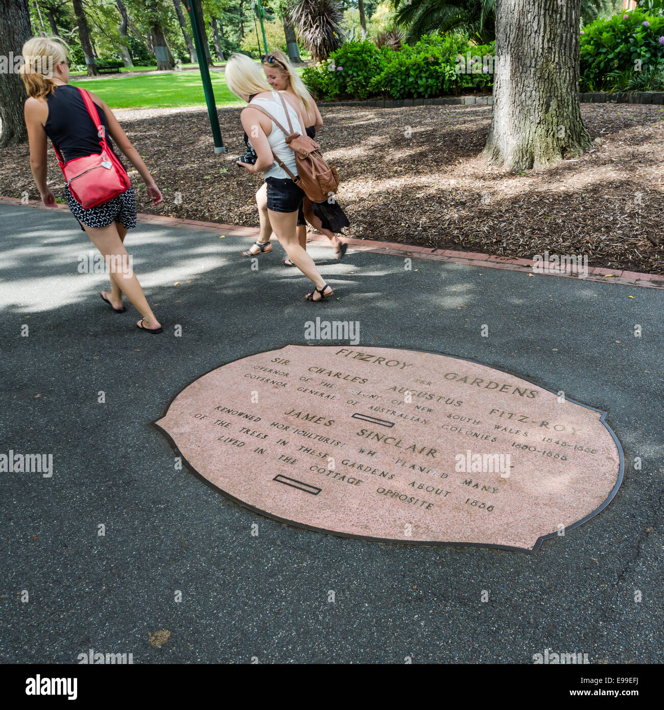 Concrete commemorative plaque set in a path in Fitzroy Gardens