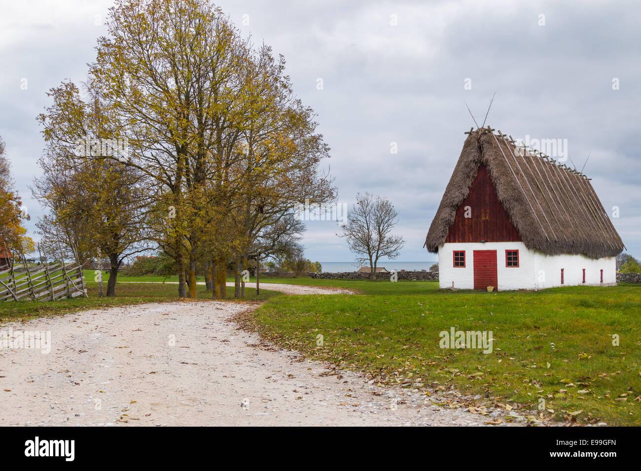 Old barn and gravel road in typical landscape of Gotland in Sweden. Stock Photo