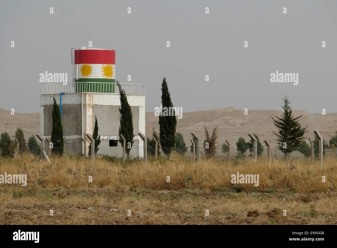 The Kurdish flag painted in a Kurdish Peshmerga military compound near Dohuk Iraq Stock Photo