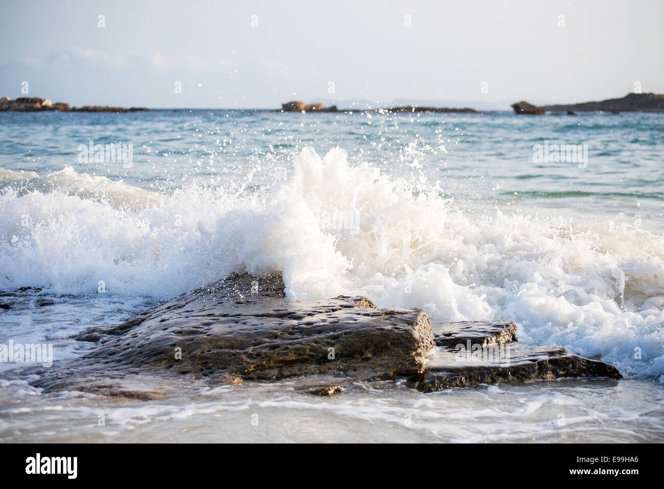 Big windy waves splashing over rocks. Storm begins. Stock Photo