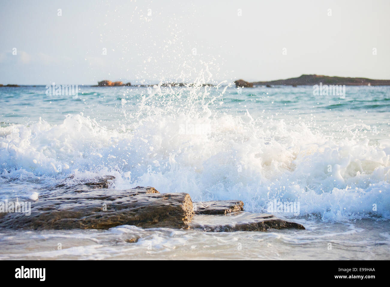 Big windy waves splashing over rocks. Storm begins. Stock Photo