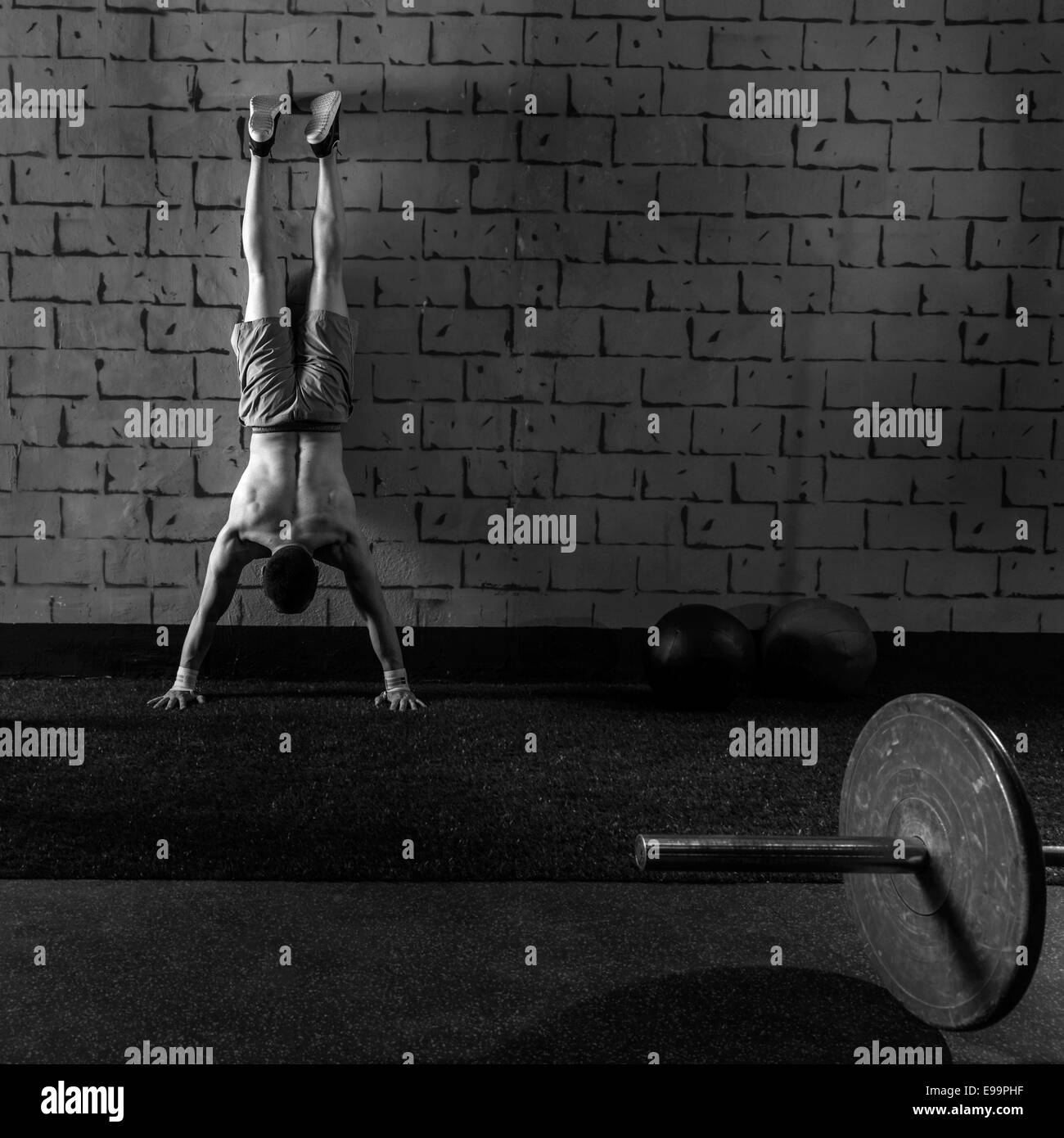 Handstand pushup man workout at gym pus ups Stock Photo Alamy