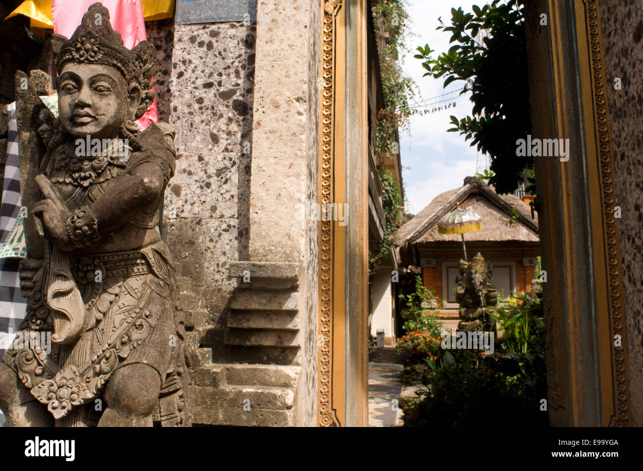 Statue at the entrance to a Hindu temple in the town of Ubud. Bali ...