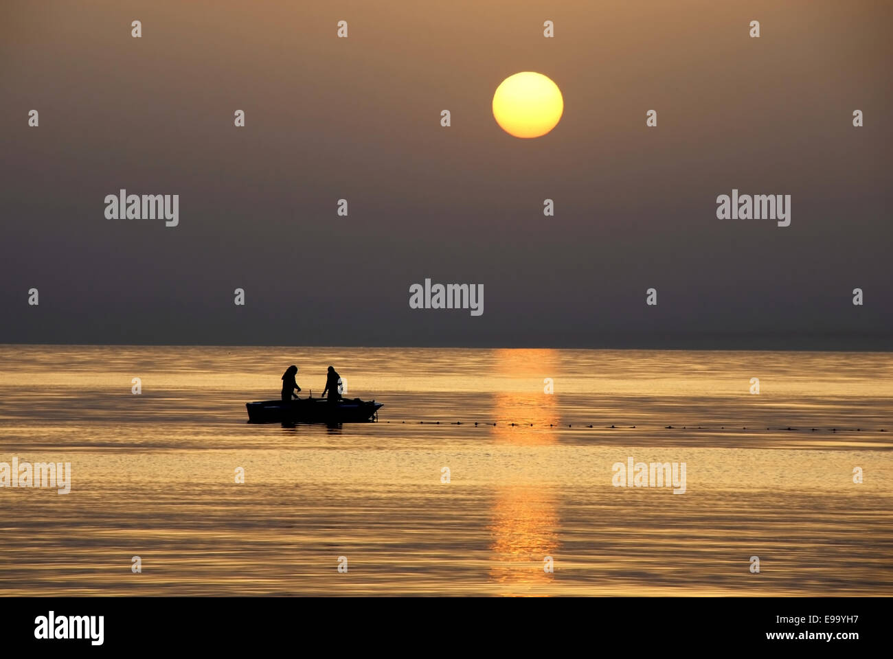 Two men fishing at sunrise hi-res stock photography and images - Alamy