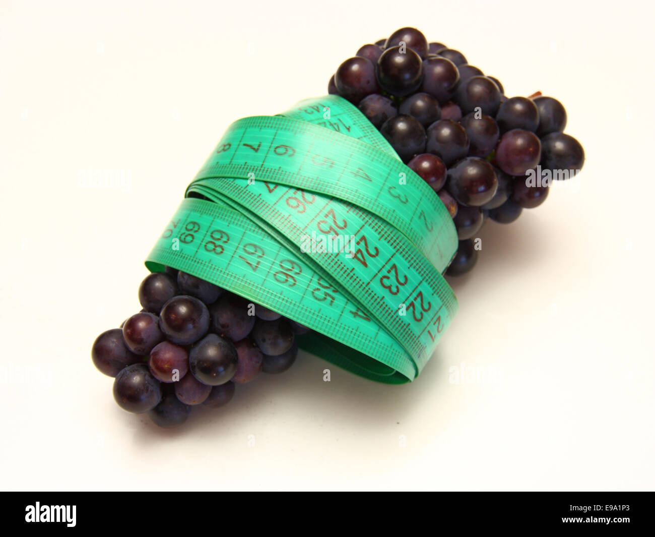 measuring tape around grapes Stock Photo