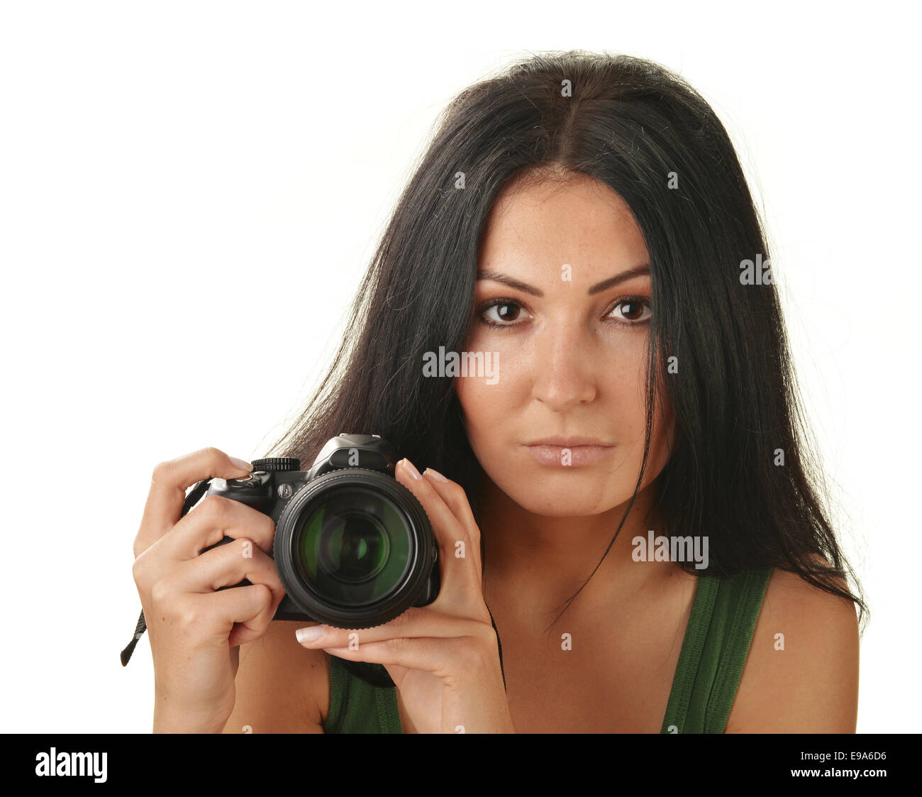 Young woman holding camera isolated on white Stock Photo - Alamy