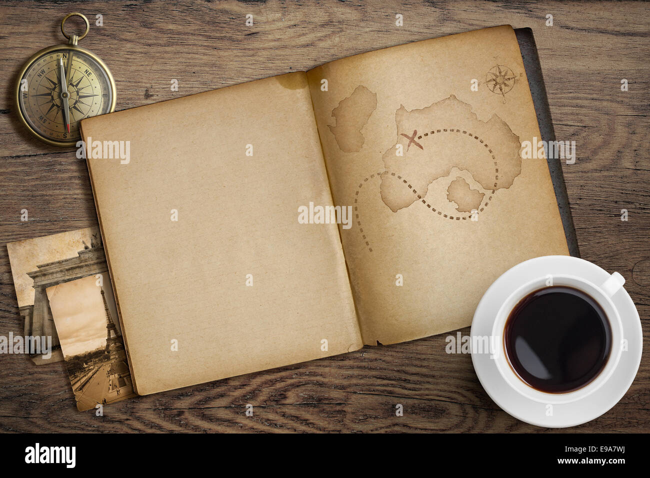 Adventure and travel nautical theme. Diary with map and compass on wooden table. Stock Photo