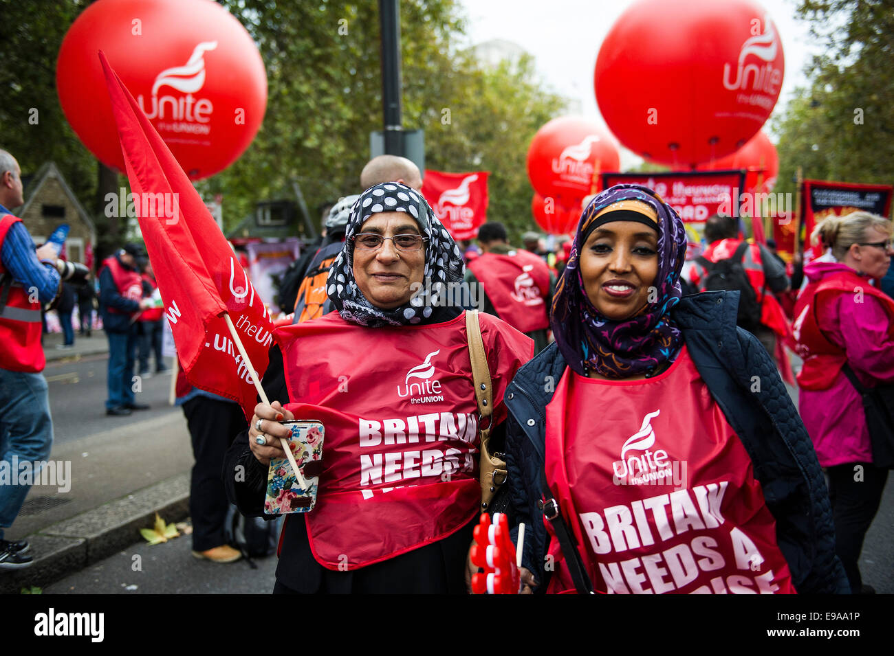 A TUC national demonstration in Central London.  Two Asian female members of the UNITE Union. Stock Photo