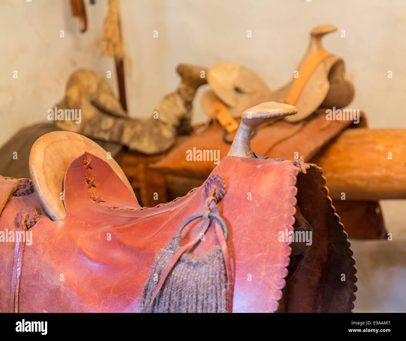 Hand made saddles in spanish mission Stock Photo Alamy