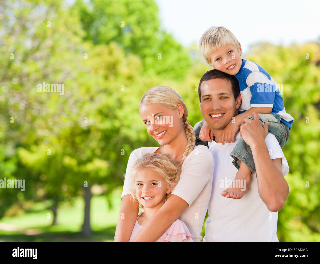 Happy family in the park Stock Photo - Alamy