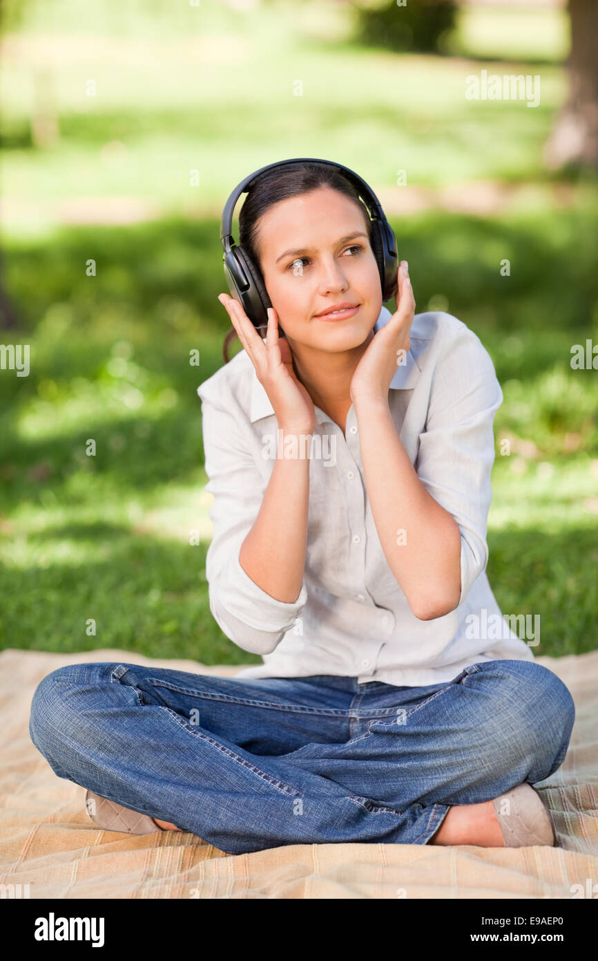 Happy young woman listening to music Stock Photo - Alamy