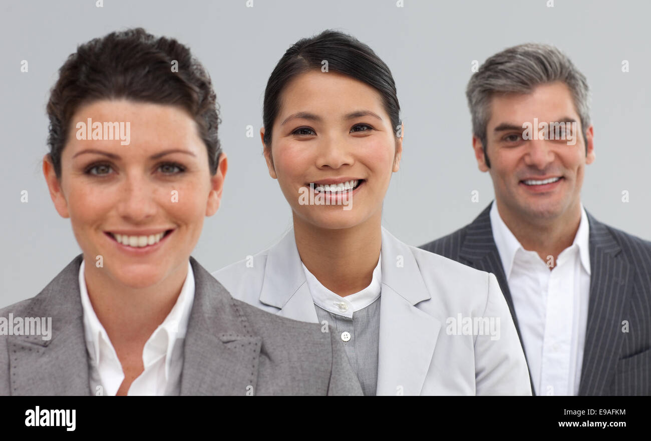 Confident business people standing together Stock Photo - Alamy